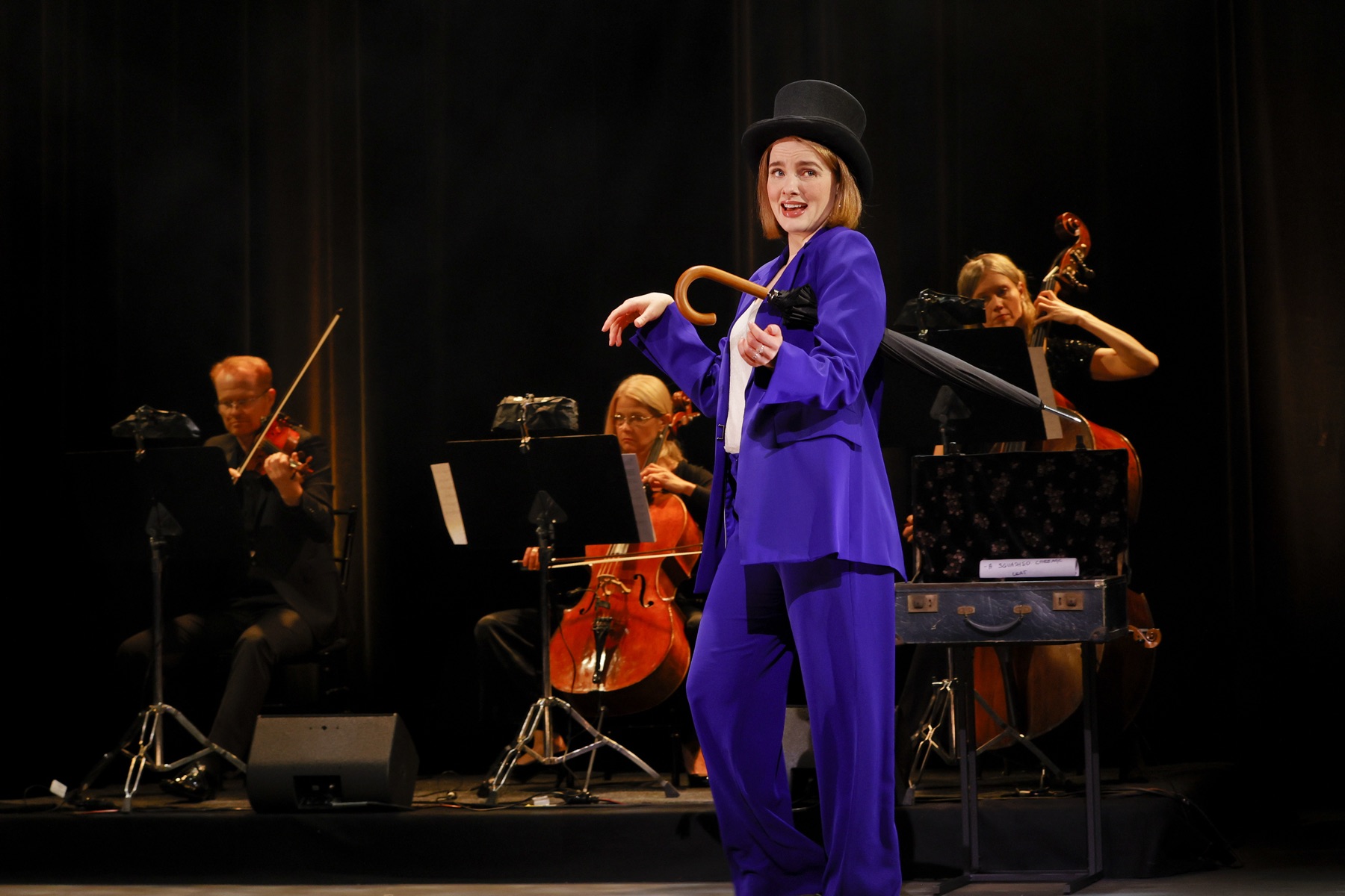 Anna O'Byrne in a top hat, a playful candid moment in Becoming Eliza